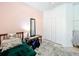 Comfortable bedroom features a well-lit window and closet for ample storage space at 4729 Spindletree Ln, Orlando, FL 32829
