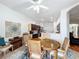 Dining room featuring a wood table and chairs with access to the kitchen at 4729 Spindletree Ln, Orlando, FL 32829
