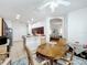 Dining room with modern lighting and access to the kitchen and living spaces at 4729 Spindletree Ln, Orlando, FL 32829
