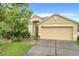 Charming one-story home with well-maintained lawn and a two-car garage in a lovely neighborhood at 4729 Spindletree Ln, Orlando, FL 32829
