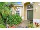 Inviting single-Gathering home with a lush, landscaped front yard, pathway to door, offering great curb appeal at 4729 Spindletree Ln, Orlando, FL 32829
