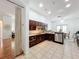 Efficient kitchen layout with tile floors, wood cabinets, and stainless steel appliances at 4729 Spindletree Ln, Orlando, FL 32829