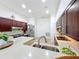 Bright kitchen features stainless steel appliances, dark wood cabinets and breakfast bar at 4729 Spindletree Ln, Orlando, FL 32829