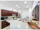 Bright and open kitchen with stainless steel appliances, dark wood cabinets and breakfast bar at 4729 Spindletree Ln, Orlando, FL 32829
