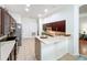 Bright kitchen with updated stainless steel appliances, breakfast bar and neutral tile floors at 4729 Spindletree Ln, Orlando, FL 32829
