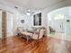 Open-concept living area with wood floors, neutral tones, and lots of natural light at 4729 Spindletree Ln, Orlando, FL 32829