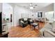 Expansive living area with multiple seating arrangements and hardwood flooring at 4729 Spindletree Ln, Orlando, FL 32829