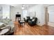 Well-lit living room featuring hardwood floors, comfortable seating, and neutral color palette at 4729 Spindletree Ln, Orlando, FL 32829