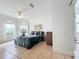 Light-filled main bedroom with neutral tones features tile flooring and a beautiful outdoor view at 4729 Spindletree Ln, Orlando, FL 32829