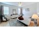 Comfortable main bedroom with a bed, dresser, and a cozy chair for relaxing at 4729 Spindletree Ln, Orlando, FL 32829
