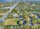 Areal view of properties with mature trees, lush green lawns and neighborhood roads at 4916 Winwood Way, Orlando, FL 32819