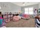 Bedroom with a colorful bed, toys, desk, and lots of room to relax and play at 4916 Winwood Way, Orlando, FL 32819