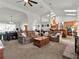 Bright and airy living room with vaulted ceiling, skylights, and comfortable seating arrangement at 4916 Winwood Way, Orlando, FL 32819