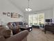 Comfortable living area with neutral tones, plush seating, large windows, and stylish decor at 4916 Winwood Way, Orlando, FL 32819