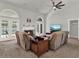 Spacious living room with high ceilings, a fireplace, and access to the outdoor pool area at 4916 Winwood Way, Orlando, FL 32819