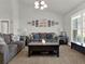 Comfortable living room with a centered coffee table and natural light from shuttered windows at 4916 Winwood Way, Orlando, FL 32819