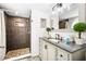 Bathroom featuring an updated vanity, a shower with tile, and modern fixtures at 5005 Laguna Bay Cir # 17, Kissimmee, FL 34746