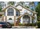 Inviting two-story condo with large arched windows and well-maintained landscaping at 5005 Laguna Bay Cir # 17, Kissimmee, FL 34746