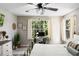Charming main bedroom featuring a ceiling fan, large window, and bright interior at 5005 Laguna Bay Cir # 17, Kissimmee, FL 34746