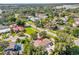Aerial shot with pin drop, showing the neighborhood featuring mature trees, backyards, and local streets at 5205 Saint Regis Pl, Belle Isle, FL 32812