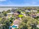 Beautiful aerial view of a neighborhood with mature trees and a home featuring a private pool and lush landscaping at 5205 Saint Regis Pl, Belle Isle, FL 32812