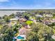 Beautiful aerial view of a neighborhood with mature trees and a home featuring a private pool and lush landscaping at 5205 Saint Regis Pl, Belle Isle, FL 32812
