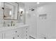 Modern bathroom featuring a walk-in shower with a glass door, a marble countertop, and bronze fixtures at 5205 Saint Regis Pl, Belle Isle, FL 32812