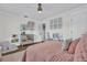 ' bedroom featuring soft, pink bedding, decor, and bright natural light at 5205 Saint Regis Pl, Belle Isle, FL 32812