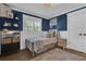 Charming bedroom with blue grasscloth wallpaper, a basketball hoop and new windows for natural light at 5205 Saint Regis Pl, Belle Isle, FL 32812