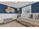 Tastefully decorated bedroom with new windows, crown molding, wood floors, and woven wall art at 5205 Saint Regis Pl, Belle Isle, FL 32812