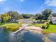 Community dock and beach area featuring well-maintained grassy areas, picnic spots, and lake access for residents at 5205 Saint Regis Pl, Belle Isle, FL 32812