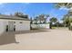 Long driveway offering ample parking, leading to the home's entrance near the gated entrance at 5205 Saint Regis Pl, Belle Isle, FL 32812