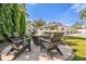 A cozy backyard fire pit and seating area, perfect for outdoor entertaining near the house at 5205 Saint Regis Pl, Belle Isle, FL 32812