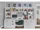 Well-organized home office setup with custom built-in shelving, drawers, and Gathering photos at 5205 Saint Regis Pl, Belle Isle, FL 32812