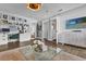 Bright and functional home office space with custom built-in shelves and decor at 5205 Saint Regis Pl, Belle Isle, FL 32812