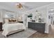 A luxurious main bedroom featuring wood floors, a stylish gray dresser, and a large mirror at 5205 Saint Regis Pl, Belle Isle, FL 32812