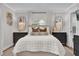 Inviting main bedroom featuring soft, neutral tones, elegant decor, and natural light at 5205 Saint Regis Pl, Belle Isle, FL 32812