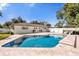 Sparkling pool with a tanning ledge, a well maintained yard and outdoor seating at 5205 Saint Regis Pl, Belle Isle, FL 32812