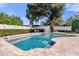 Beautiful pool with outdoor furniture, mature landscaping, and a fenced in backyard at 5205 Saint Regis Pl, Belle Isle, FL 32812