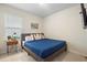 Cozy bedroom featuring natural light, soft textiles, and tiled floors at 5298 Royal Point Ave, Kissimmee, FL 34746