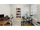 Bedroom featuring a wooden desk, electronic drums, and a keyboard setup at 5298 Royal Point Ave, Kissimmee, FL 34746