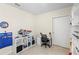 Bright bedroom featuring an organized desk area, white shelving and closet at 5298 Royal Point Ave, Kissimmee, FL 34746