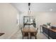 Dining room with modern light fixture and sliding glass doors to back patio at 5298 Royal Point Ave, Kissimmee, FL 34746
