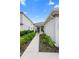 Inviting front entrance with manicured landscaping and a charming walkway leading to the front door at 5298 Royal Point Ave, Kissimmee, FL 34746