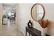 Entryway leading to a dining area, featuring modern decor and ample natural light at 5298 Royal Point Ave, Kissimmee, FL 34746