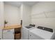 Well-equipped laundry room with a wood countertop, washer, and dryer at 5298 Royal Point Ave, Kissimmee, FL 34746