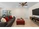 Relaxing living room with comfortable seating and tile floors at 5298 Royal Point Ave, Kissimmee, FL 34746