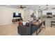 Open-concept living area with modern lighting, tile flooring, and a seamless flow to the kitchen at 5298 Royal Point Ave, Kissimmee, FL 34746