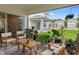 Cozy covered patio featuring stylish outdoor furniture and lush greenery, perfect for relaxing at 5298 Royal Point Ave, Kissimmee, FL 34746