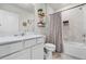 Clean bathroom with a white vanity, framed mirror, and a shower-tub combination at 5329 Royal Point Ave, Kissimmee, FL 34746